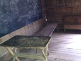 A true black board and the teacher's desk in the Greenbrier School